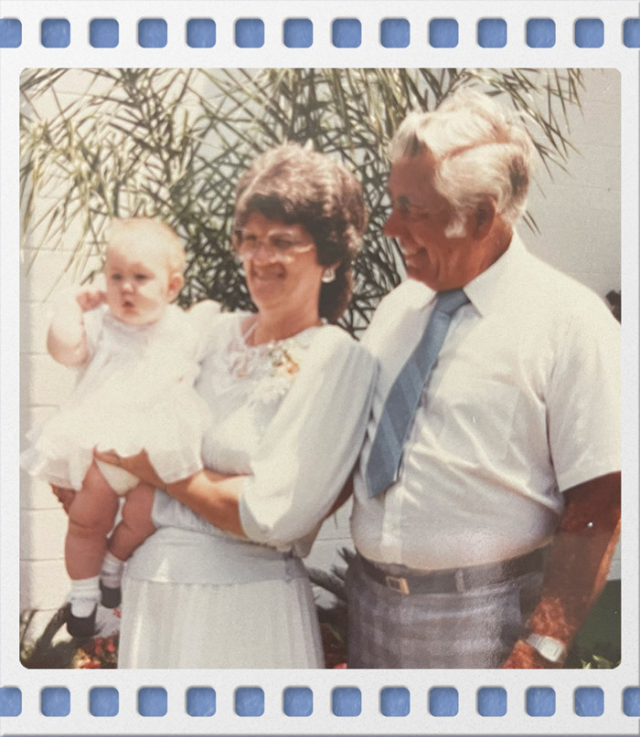 Family photo of Janice Hart posing with her husband & Ashley Hart as a baby